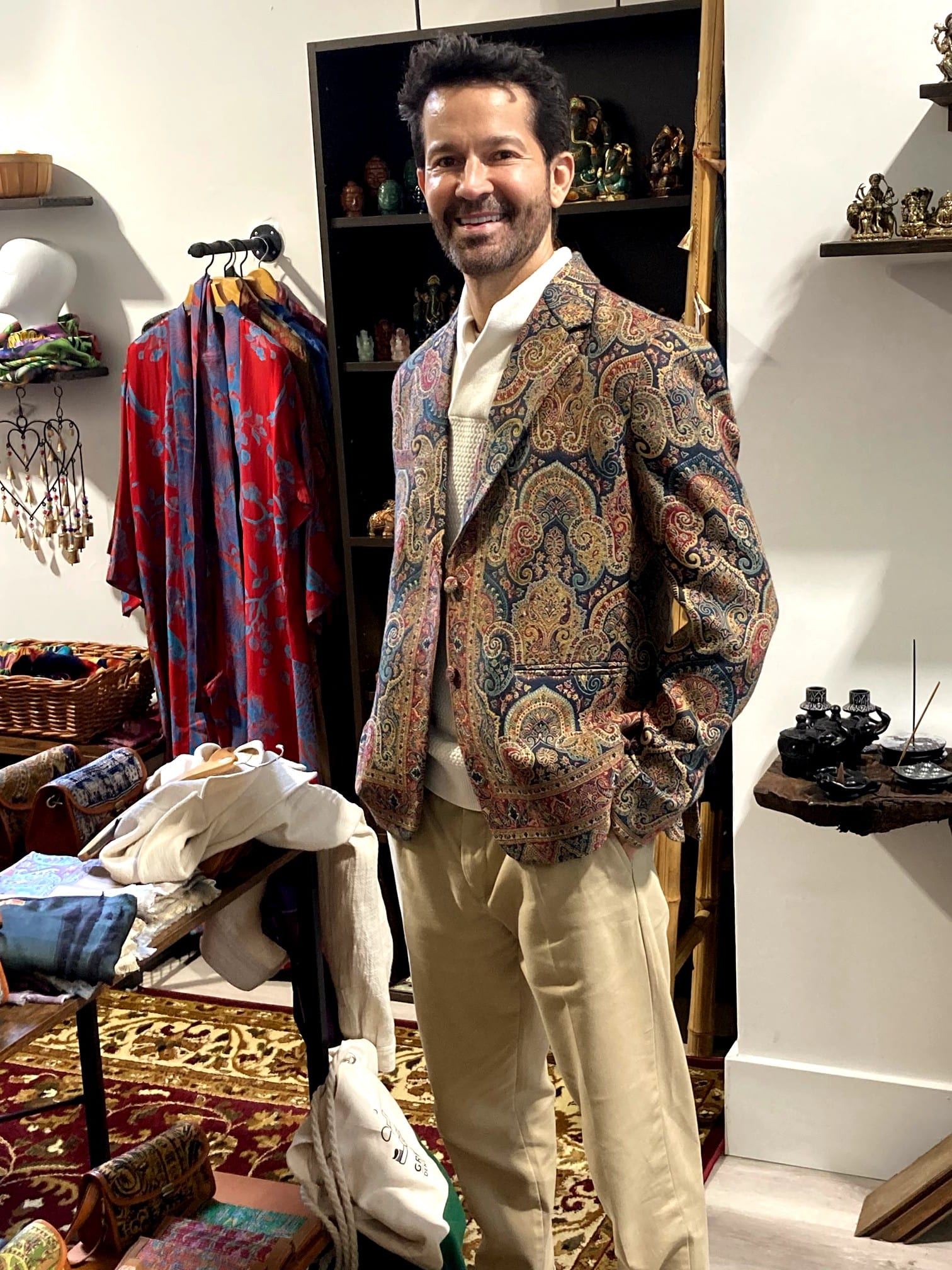 Customer wearing a handcrafted paisley blazer from Taj Mahal