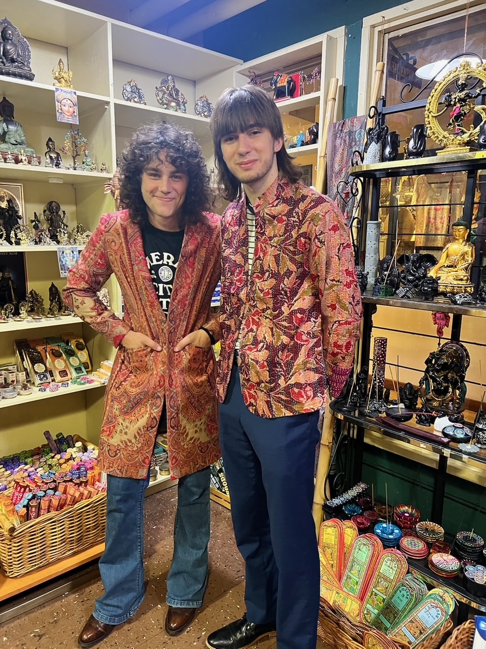 Two customers wearing paisley jackets from Taj Mahal Emporium