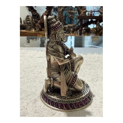 Silver Seated Deity Statue