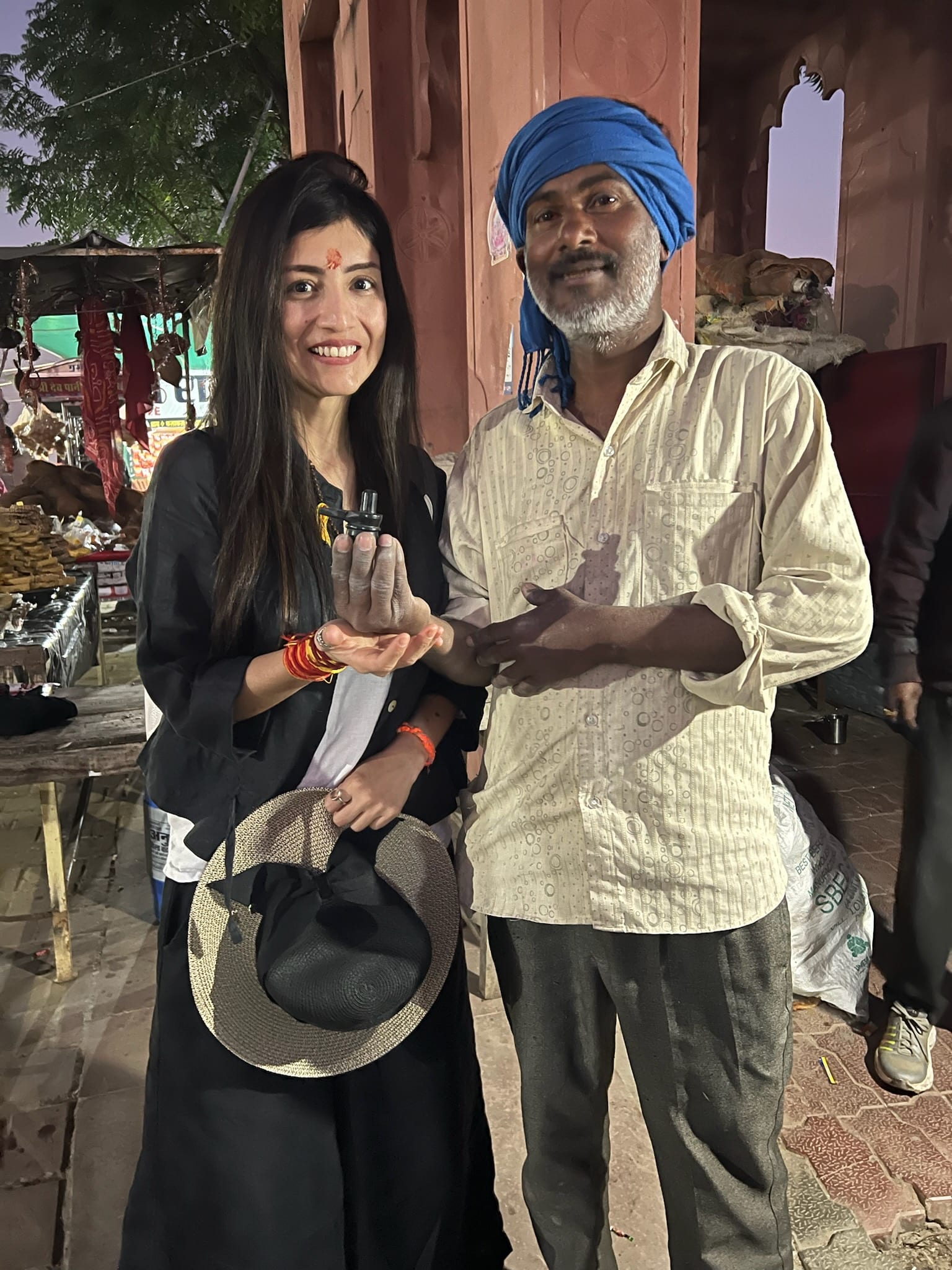 With a local vendor at a market in India