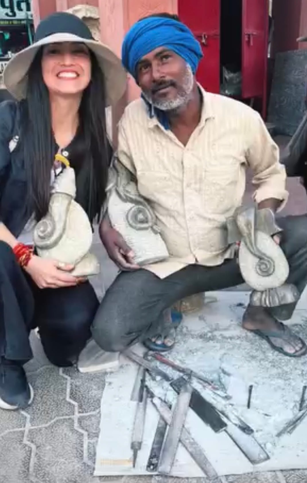 With an Indian stone carver during a sourcing journey in India